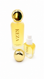 Two KEZA fragrance bottles on a white background: a tall frosted bottle with a large metallic gold cap, a smaller frosted bottle with a white top, and a separate round metallic gold lid in front.
