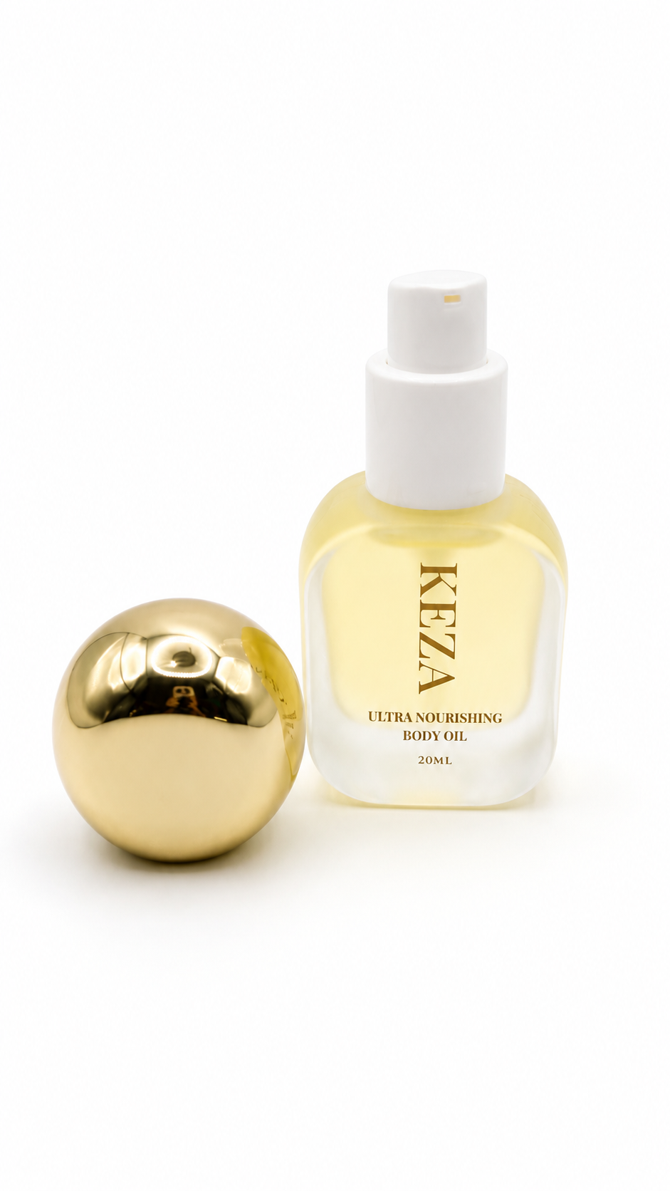 KEZA mini Ultra Nourishing Body Oil in a frosted glass bottle with a white spray cap, shown next to its reflective gold spherical cap on a white background.